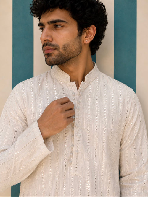 Man wearing ivory mirror work embroidered kurta - front view