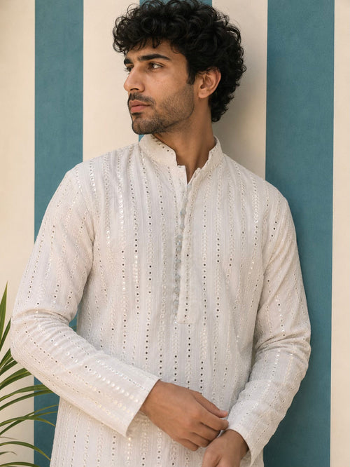 Man wearing AAINA ivory mirror work kurta - side pose