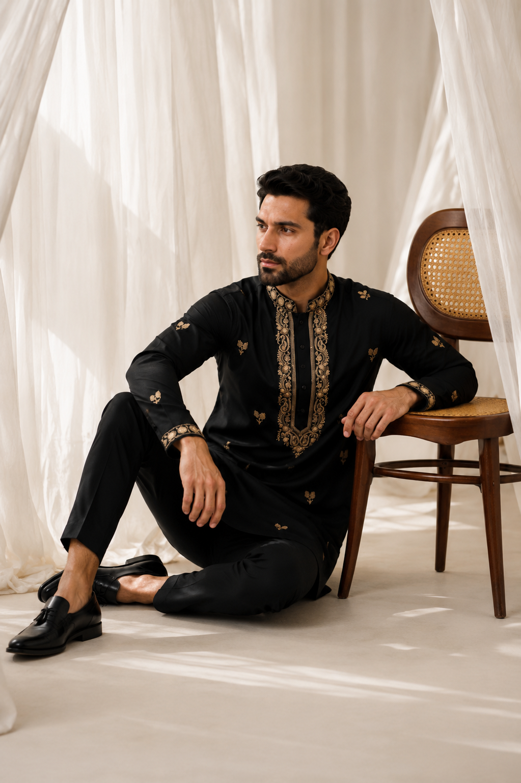 MEHFIL black and gold embroidered kurta for men - seated shot