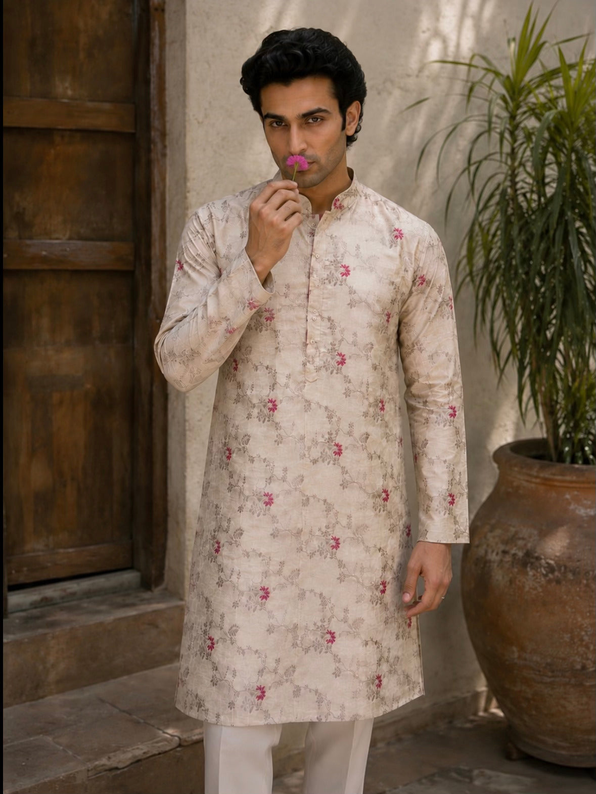 Close-up of floral jacquard weave and mandarin collar on NAZAAKAT kurta