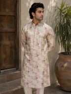 Man wearing light gold floral jacquard kurta - front view